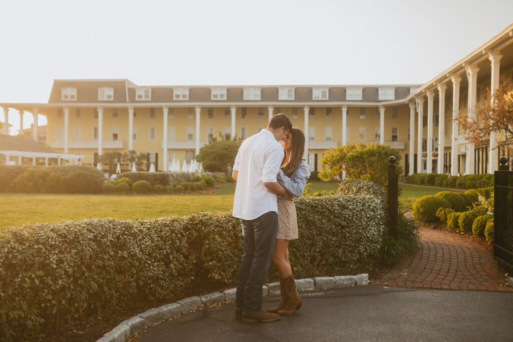 Congress Hall New Jersey Engagement Photos in front of yellow hotel in Cape May NJ