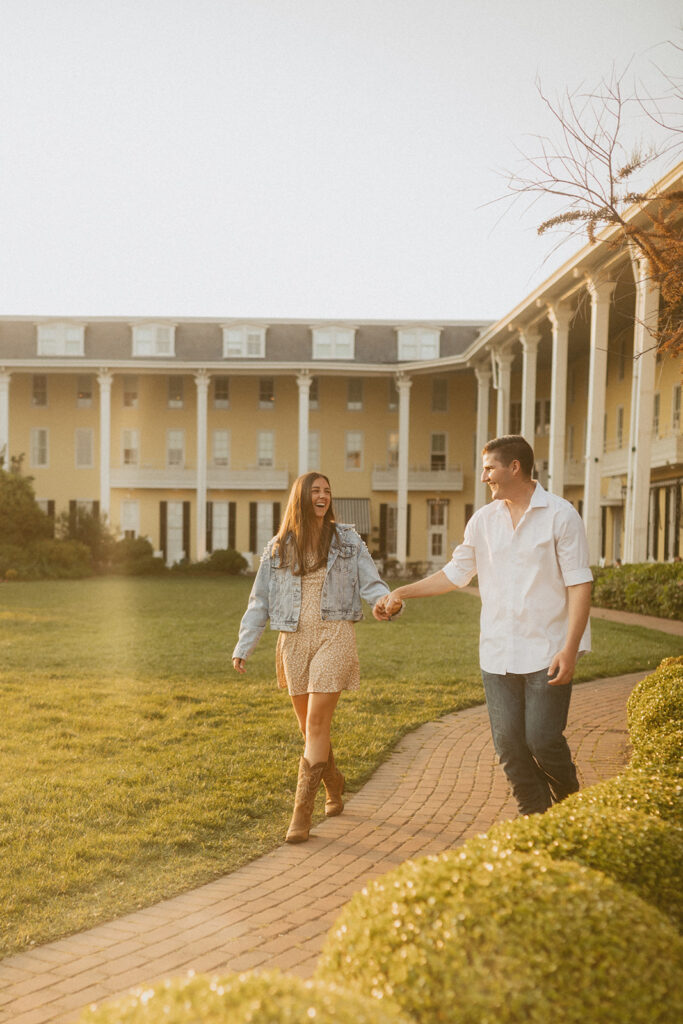 Congress Hall New Jersey Engagement Photos in front of yellow hotel in Cape May NJ