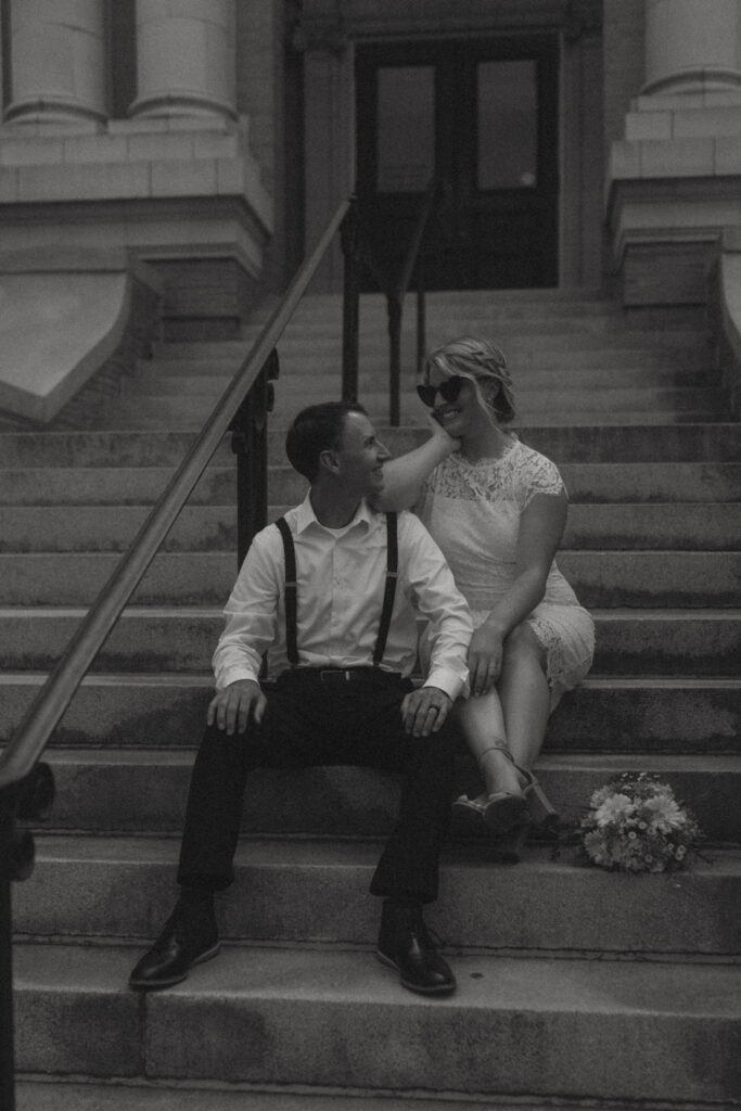 Couple on Ocean City NJ Courthouse steps posing for elopement