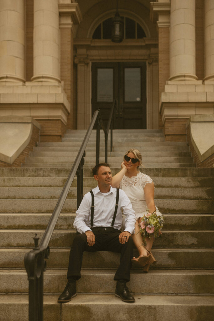 Couple on Ocean City NJ Courthouse steps posing for elopement