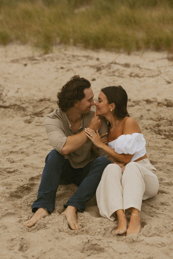 Couples standing on the beach on Sunset Beach in NJ for engagement photos