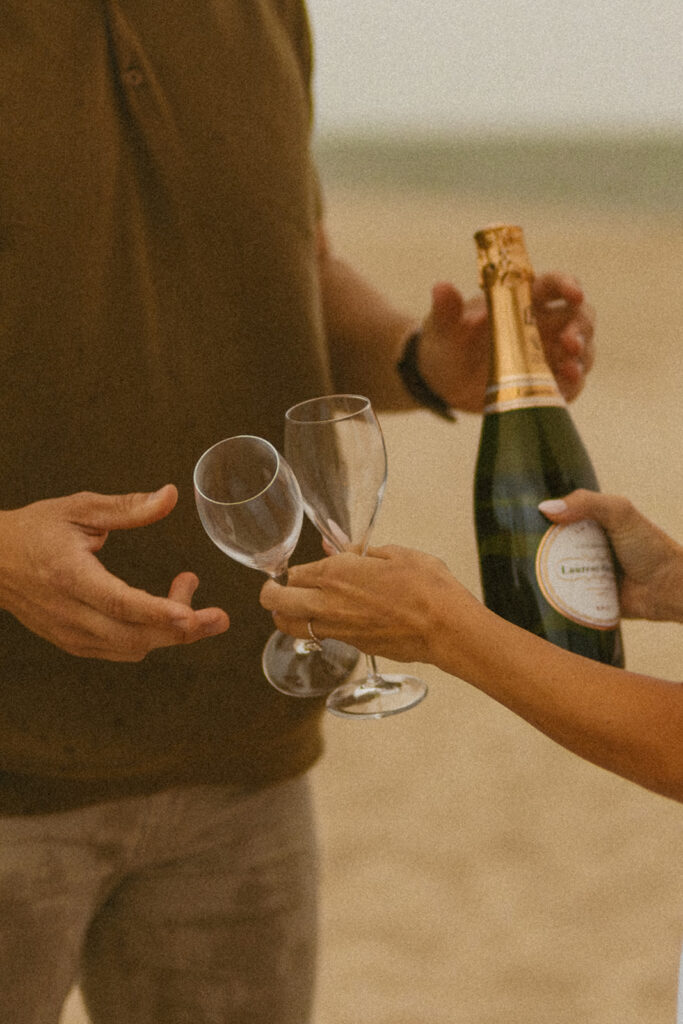 engagement photos with champagne